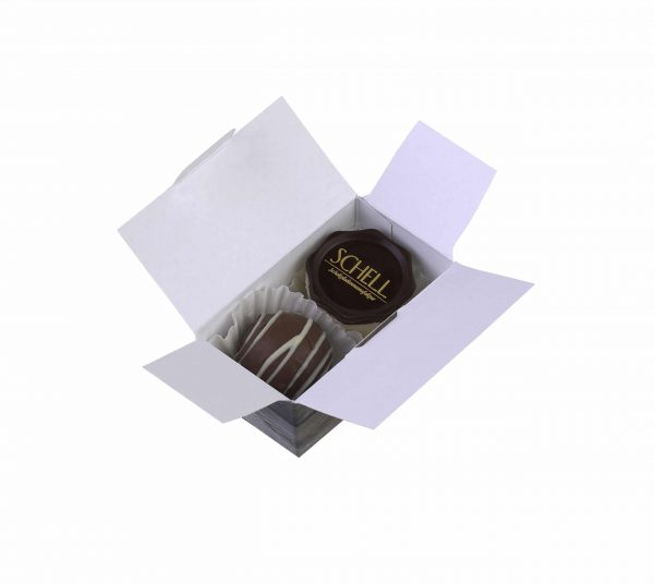 2er Schatulle "Triologie Nougat" von Schell Schokoladen beinhaltet eine Nougat Crisp und eine Creme Sahnenougat Praline in einer kleinen von innen Flieder und außen Holz Pappschachtel